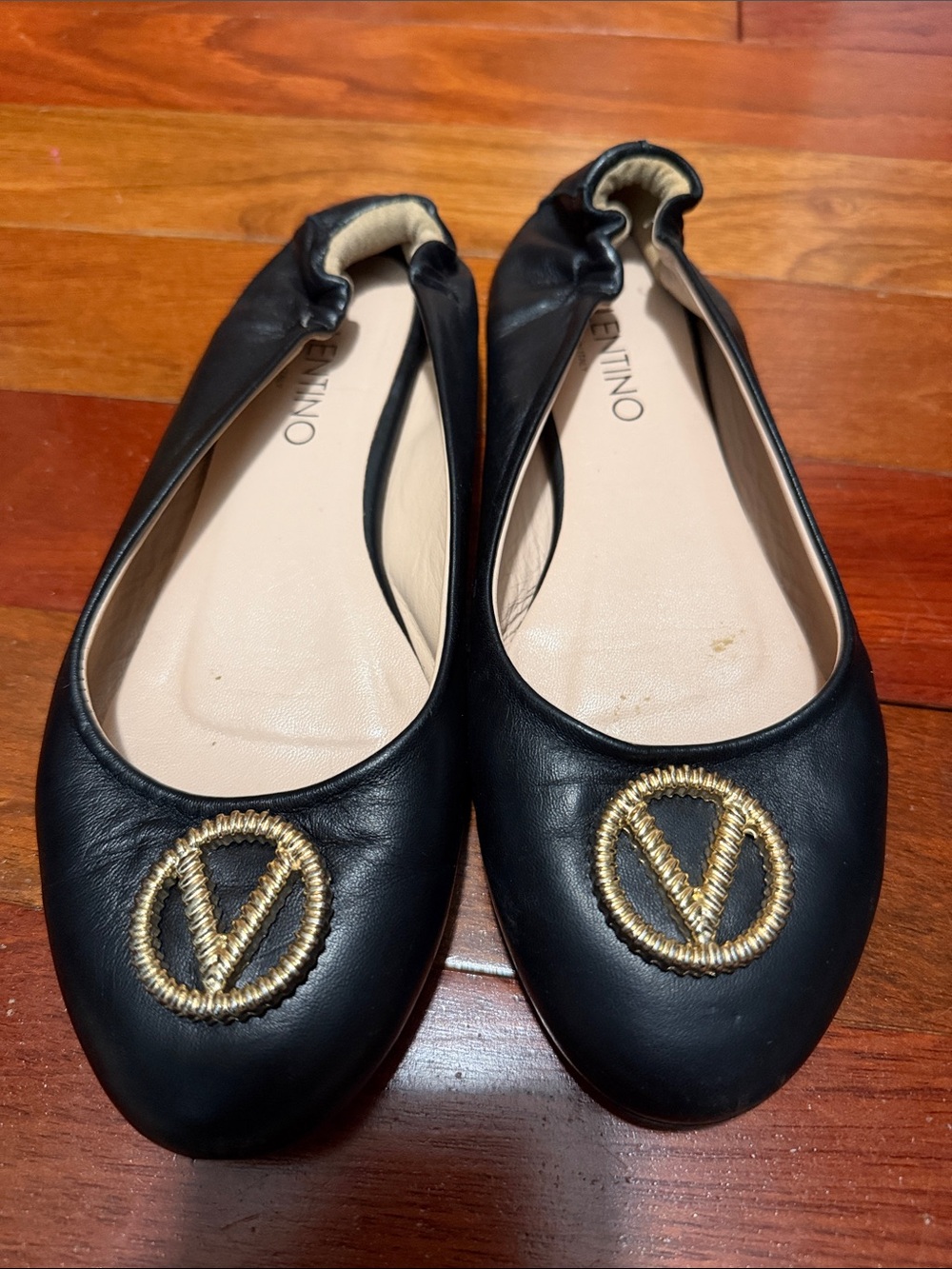 Valentino Black Leather Ballet Flats with Gold Logo Medallions